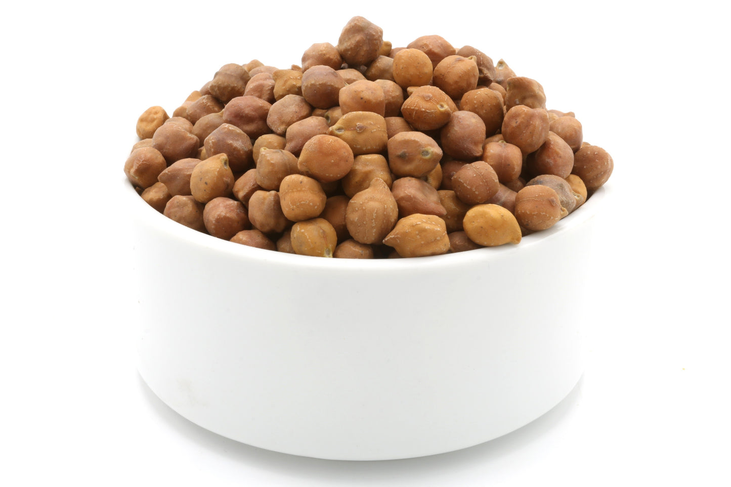 White bowl filled with brown dried beans on a white background
