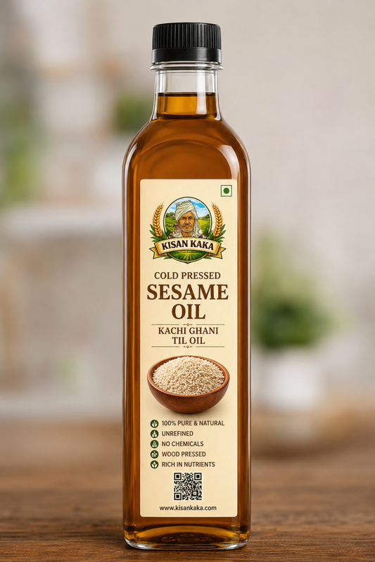 Bottle of Kisan Kaka cold pressed sesame oil on a wooden surface with a blurred background